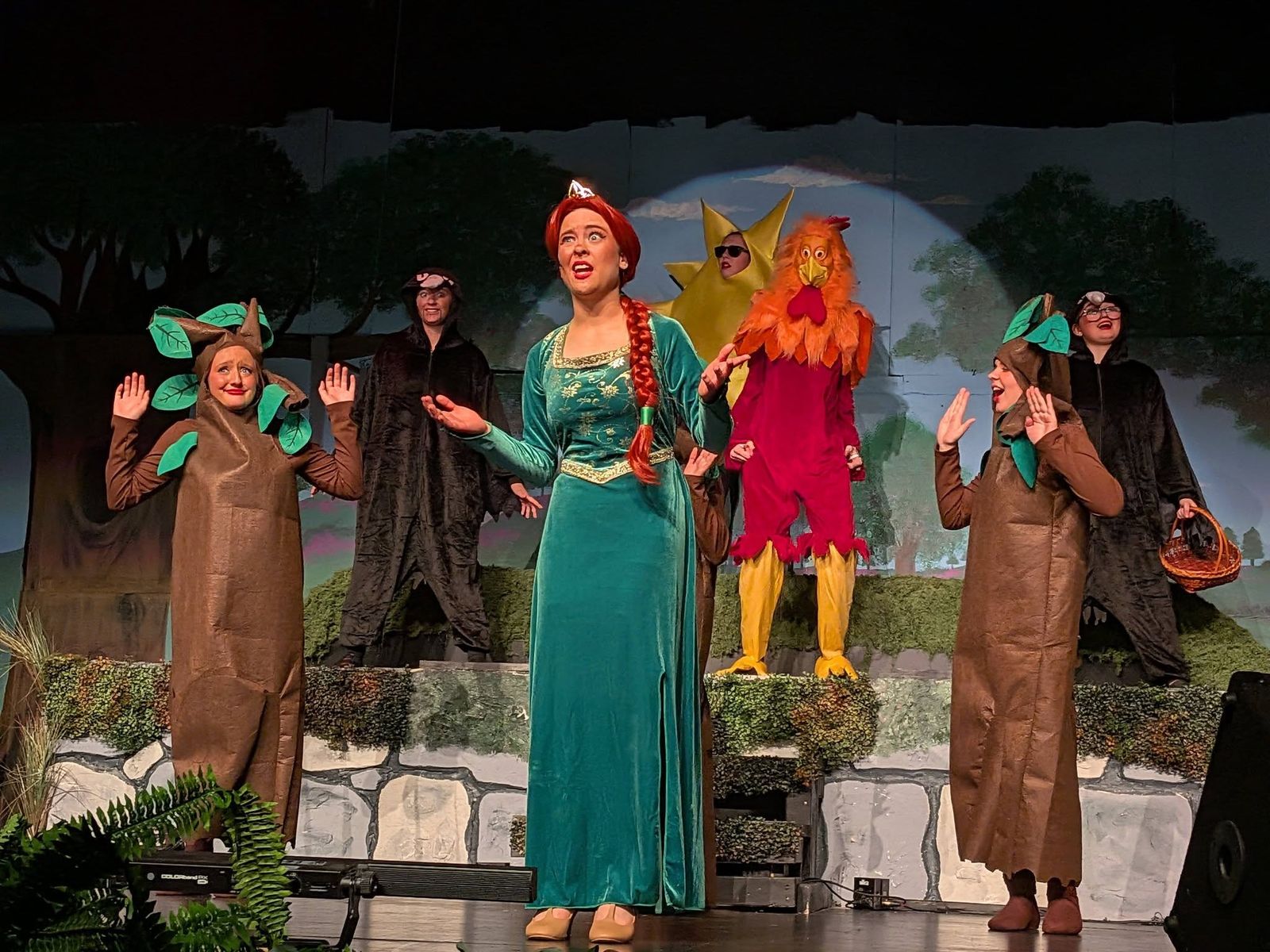Fiona singing with tree and bird characters