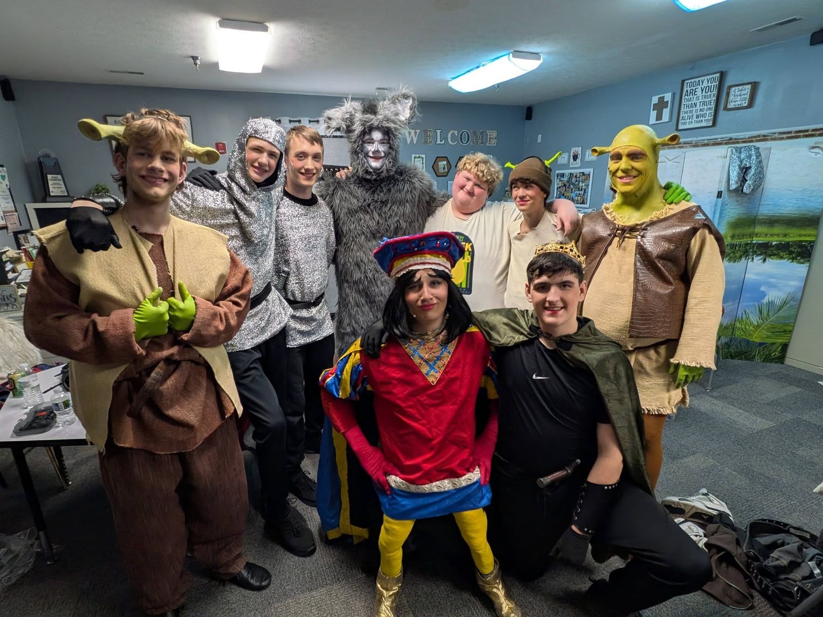 Cast members in costume backstage